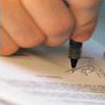 Photo of notary signing a document
