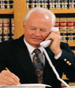 Photo of a man conducting research on the phone